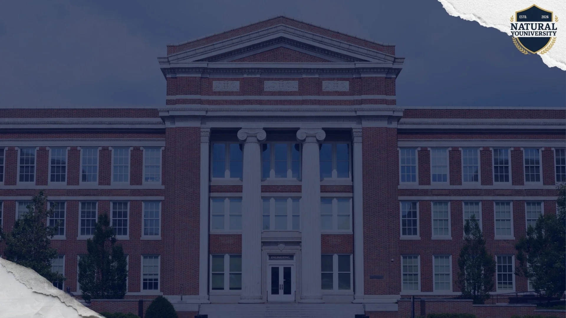 Front view of a large brick university building with classical columns and a pediment, labeled as Engineering building.