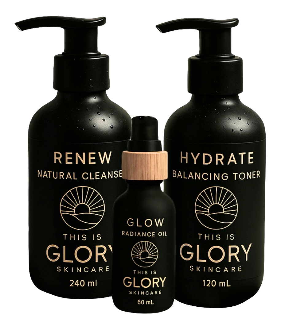 Three black skincare bottles with pump dispensers, labeled 'Renew Natural Cleanser,' 'Hydrate Balancing Toner,' and 'Glow Radiance Oil,' from 'This Is Glory Skincare,' with minimalist sunset and hill logo and white text, on a dark background.