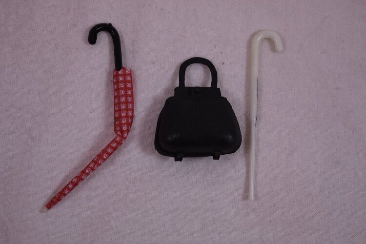 Mary Poppin's umbrella, bag and walking cane.