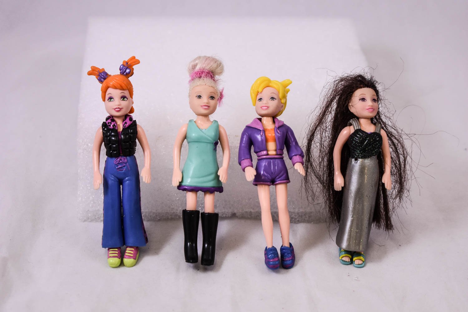 4 different Polly Pocket characters