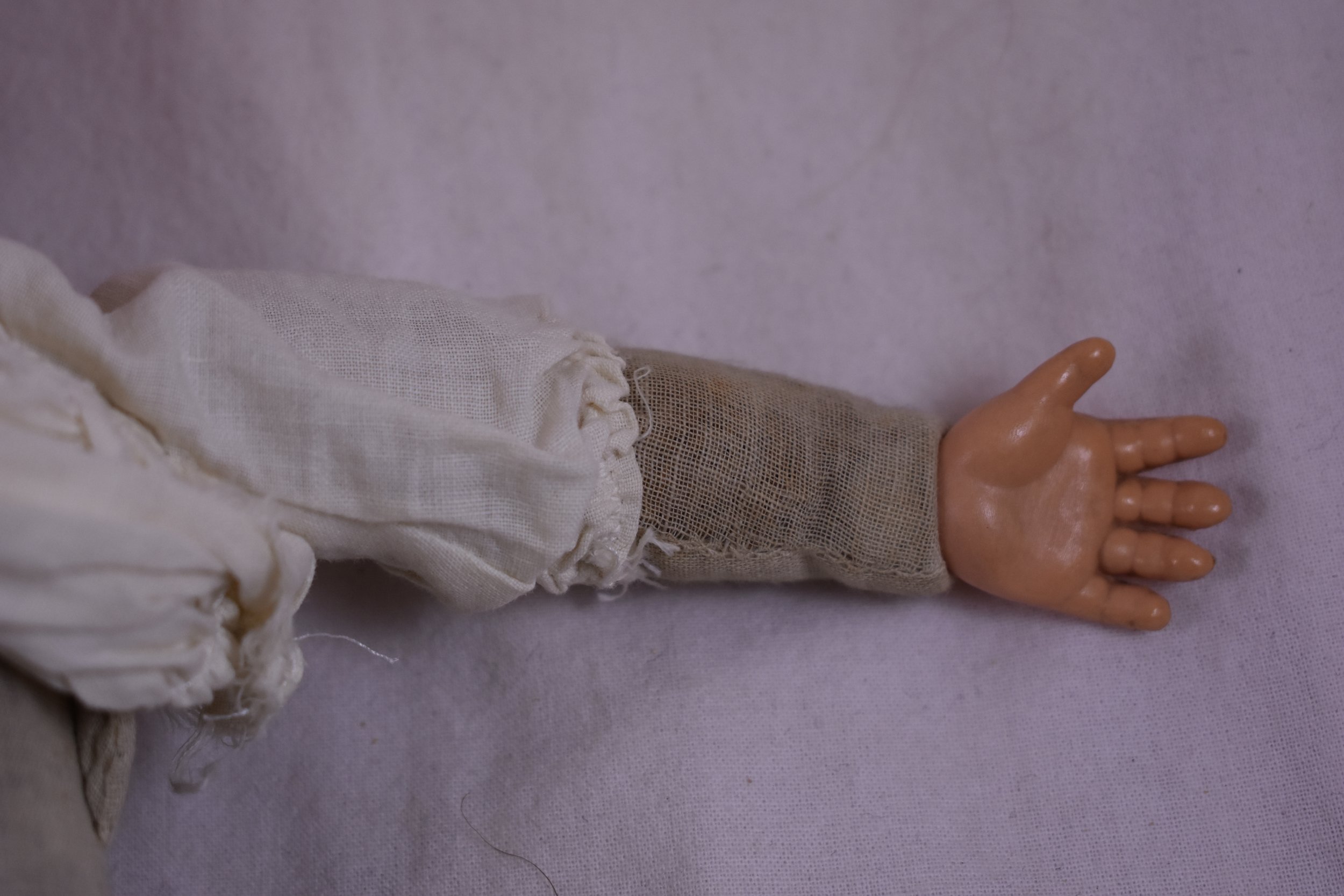 Composite hand attached to a cloth arm
