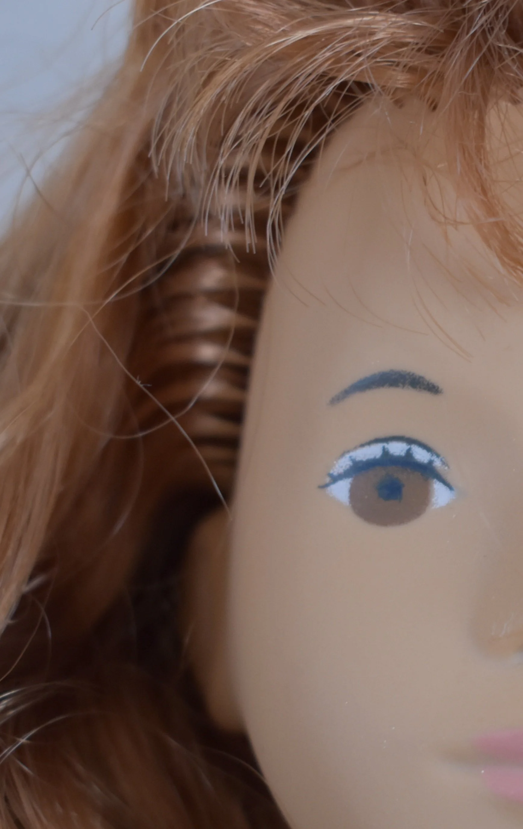 Rooted, synthetic hair.