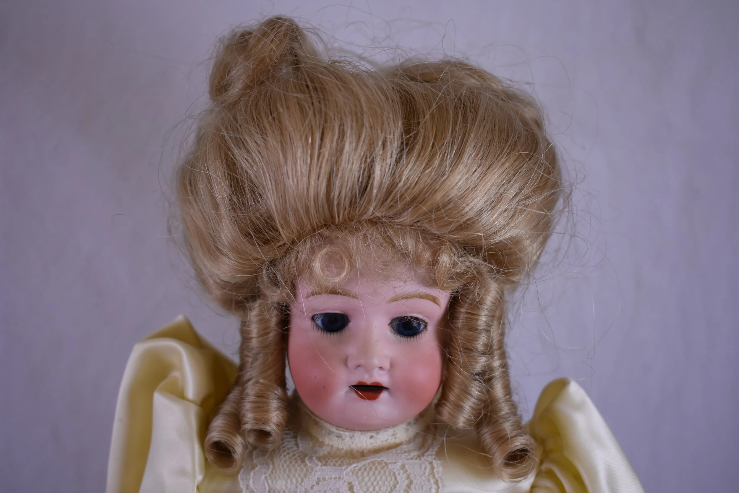 Elaborate coiffure, front view.