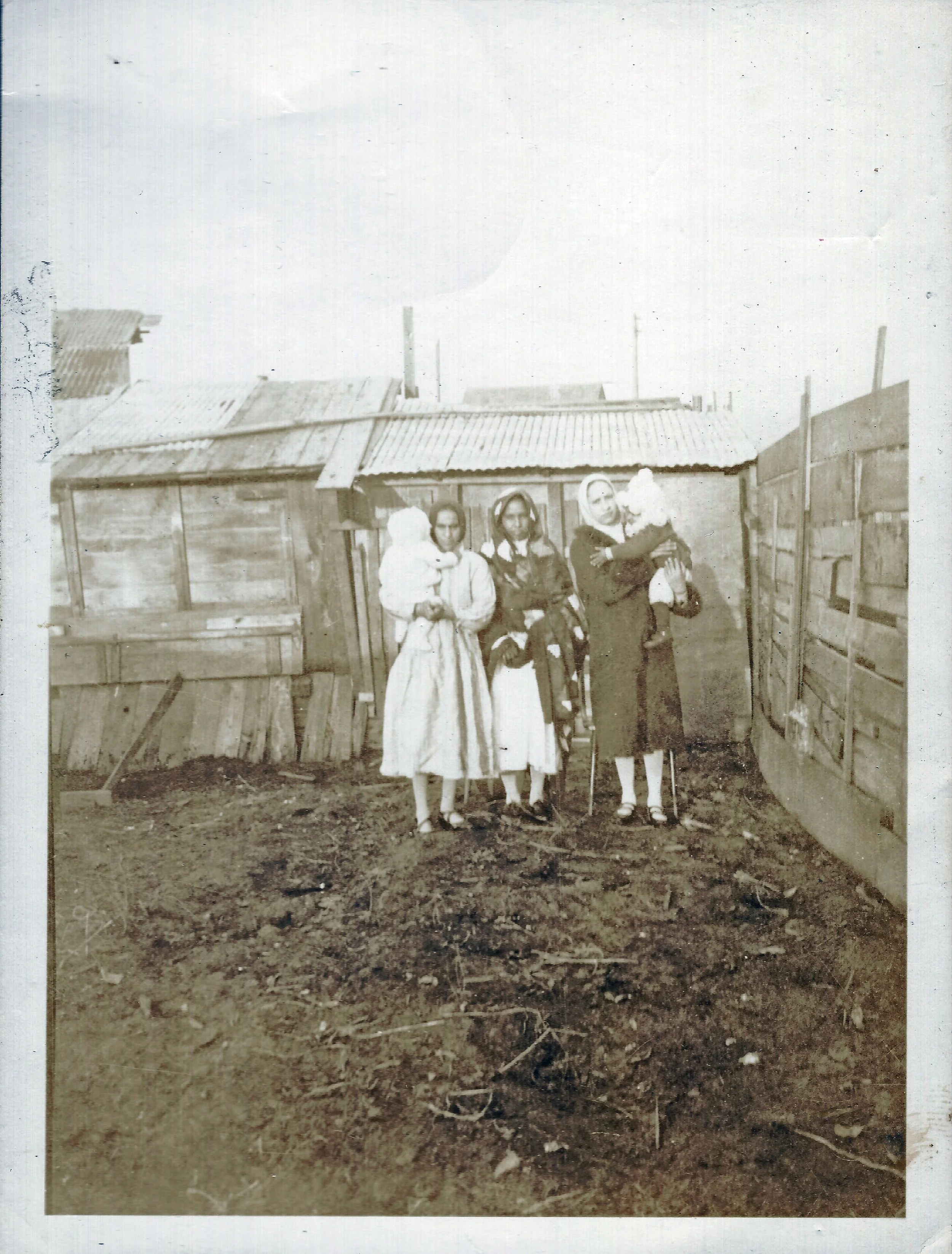 These ladies and children are in a back yard, somewhere in Millside, Fraser Mills, circa 1930s. Mike Ghuman's father, Rattan Singh, grew up with their husbands. Courtesy of Mike Ghuman.