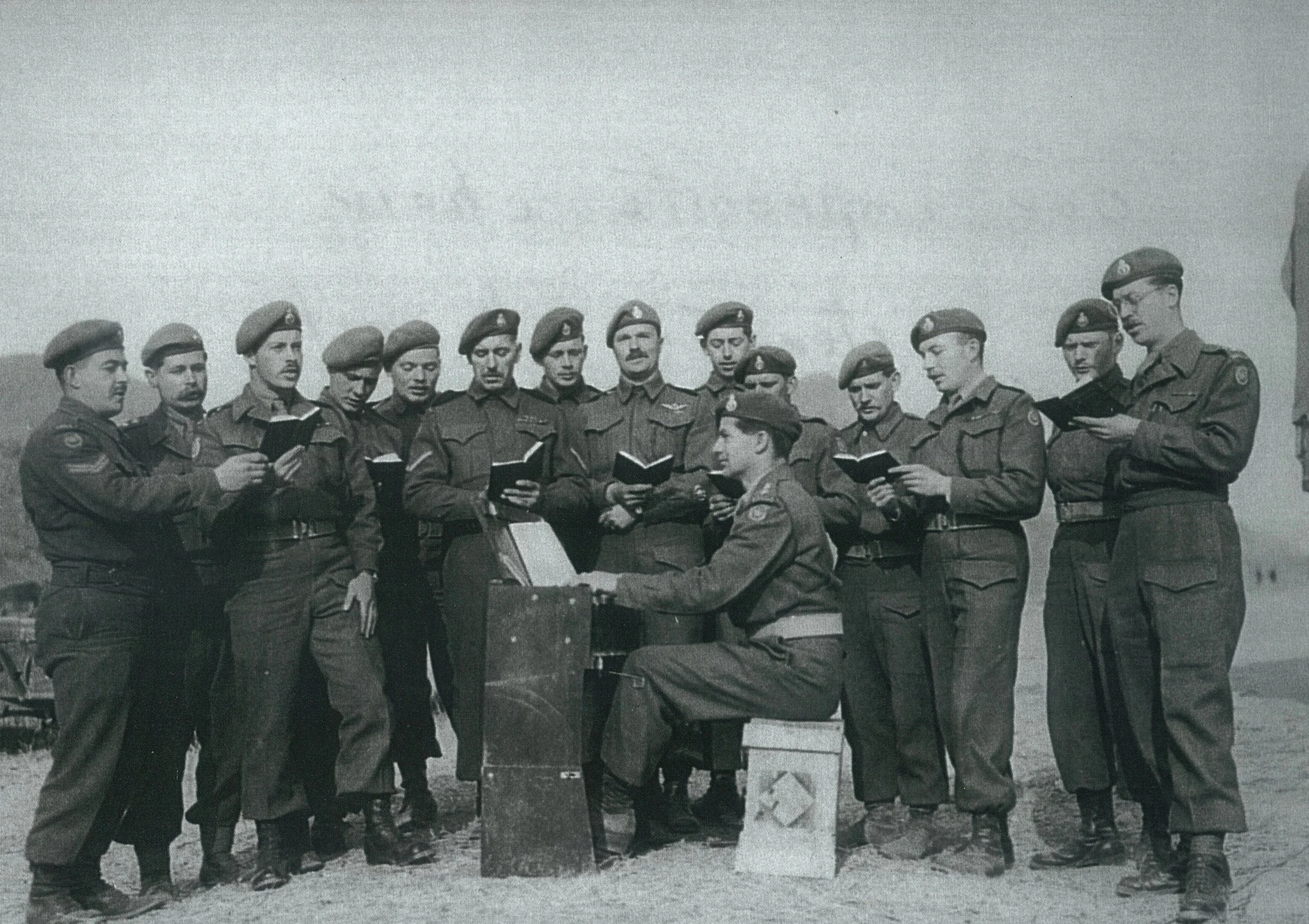 Canadian soldiers partake in an outdoor service.