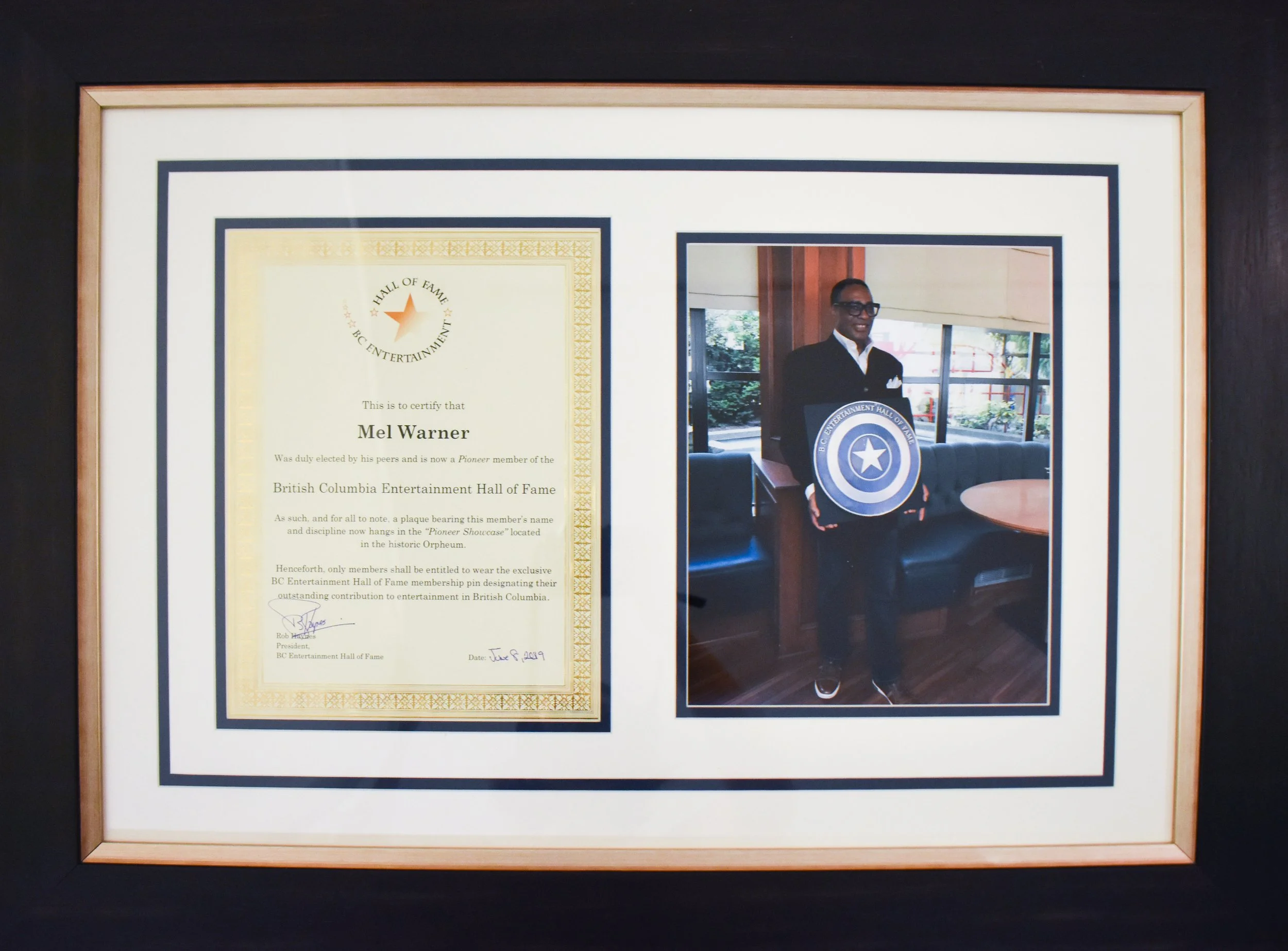 Commemorative document and photo from Mel Warner’s 2019 induction into the BC Entertainment Hall of Fame, where he was recognized as a promoter and for introducing new styles of music through his radio show.