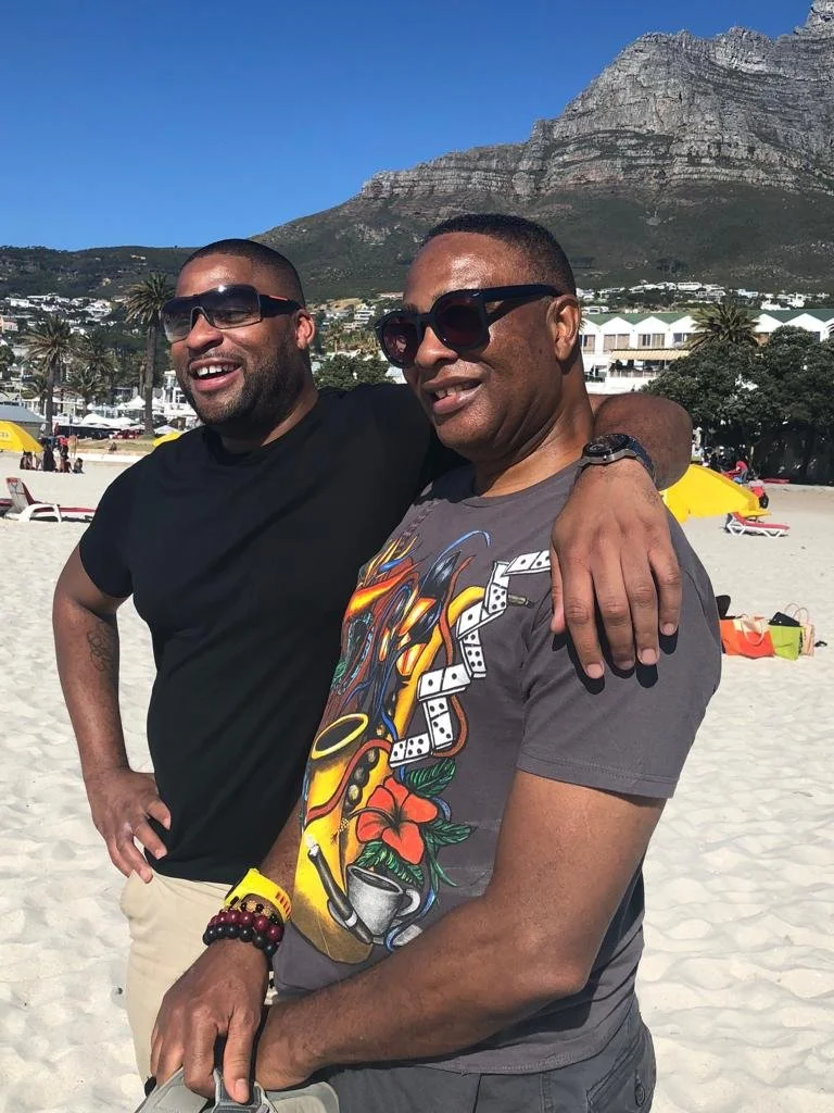 Mel on vacation with his son, Jason, in South Africa.