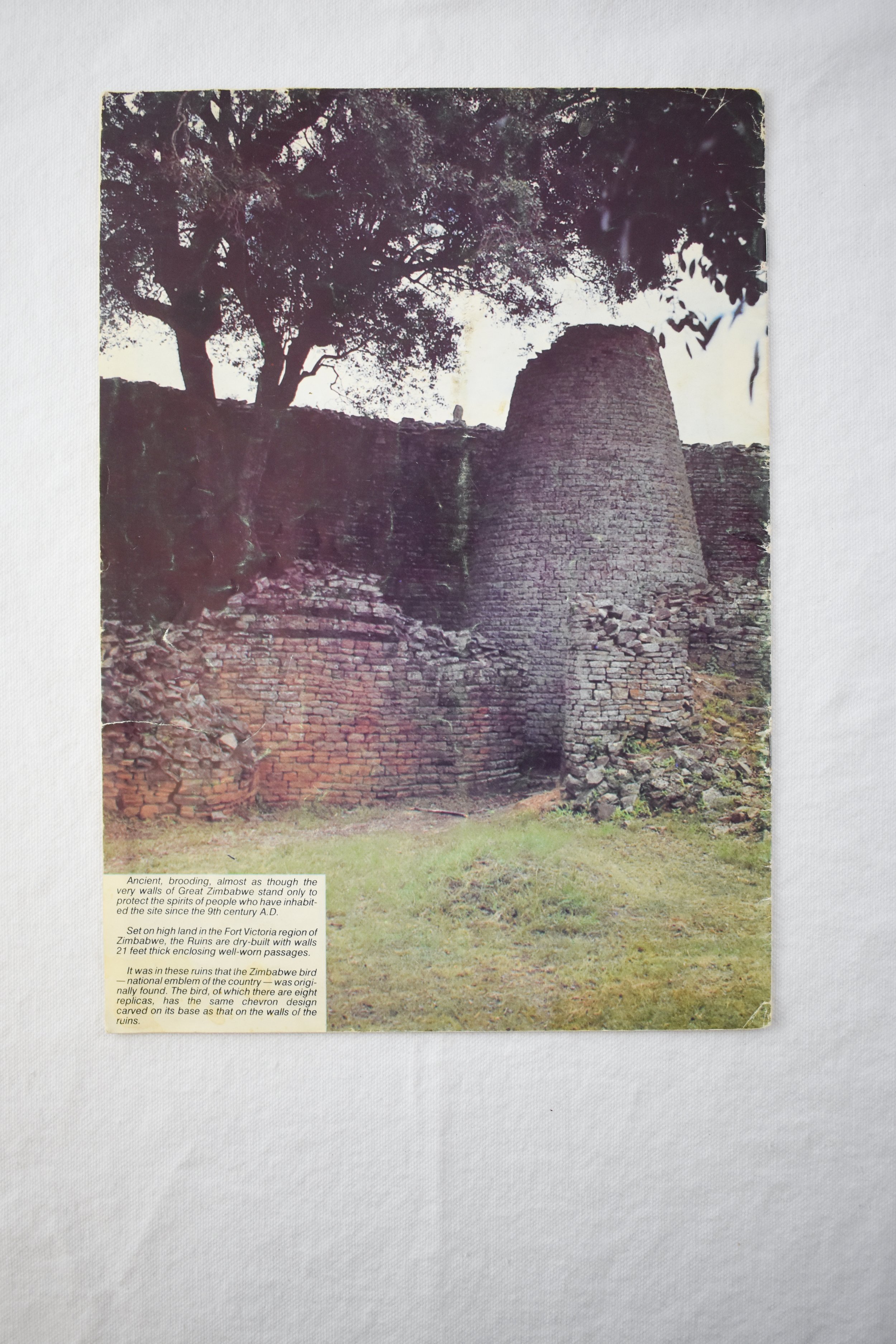 Back cover of a commemorative book marking Zimbabwe’s independence from Rhodesian rule in 1980. The image shows the ruins of Great Zimbabwe, a medieval city in southeastern Zimbabwe that is thought to have been the capital of an Iron Age empire estab