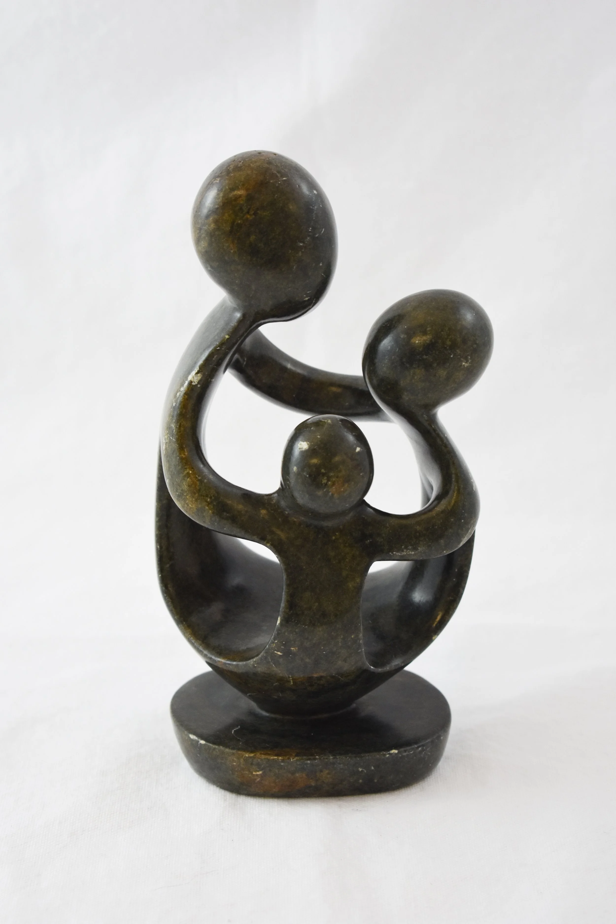 Small statue made from verdite, a type of serpentine stone common in Zimbabwe. The Shona people have a long tradition of stone-working and have become world-famous for their stone sculptures. Most sculptures are made for decoration and were rarely ex