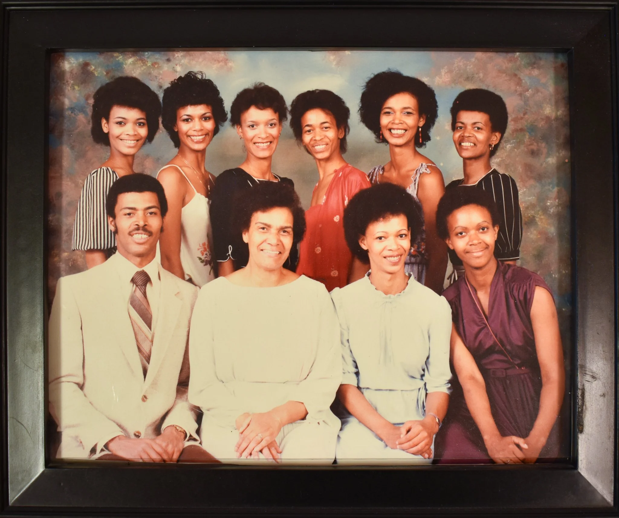 A family portrait with Candace’s mother and siblings. Candace is second from the left in the back row.