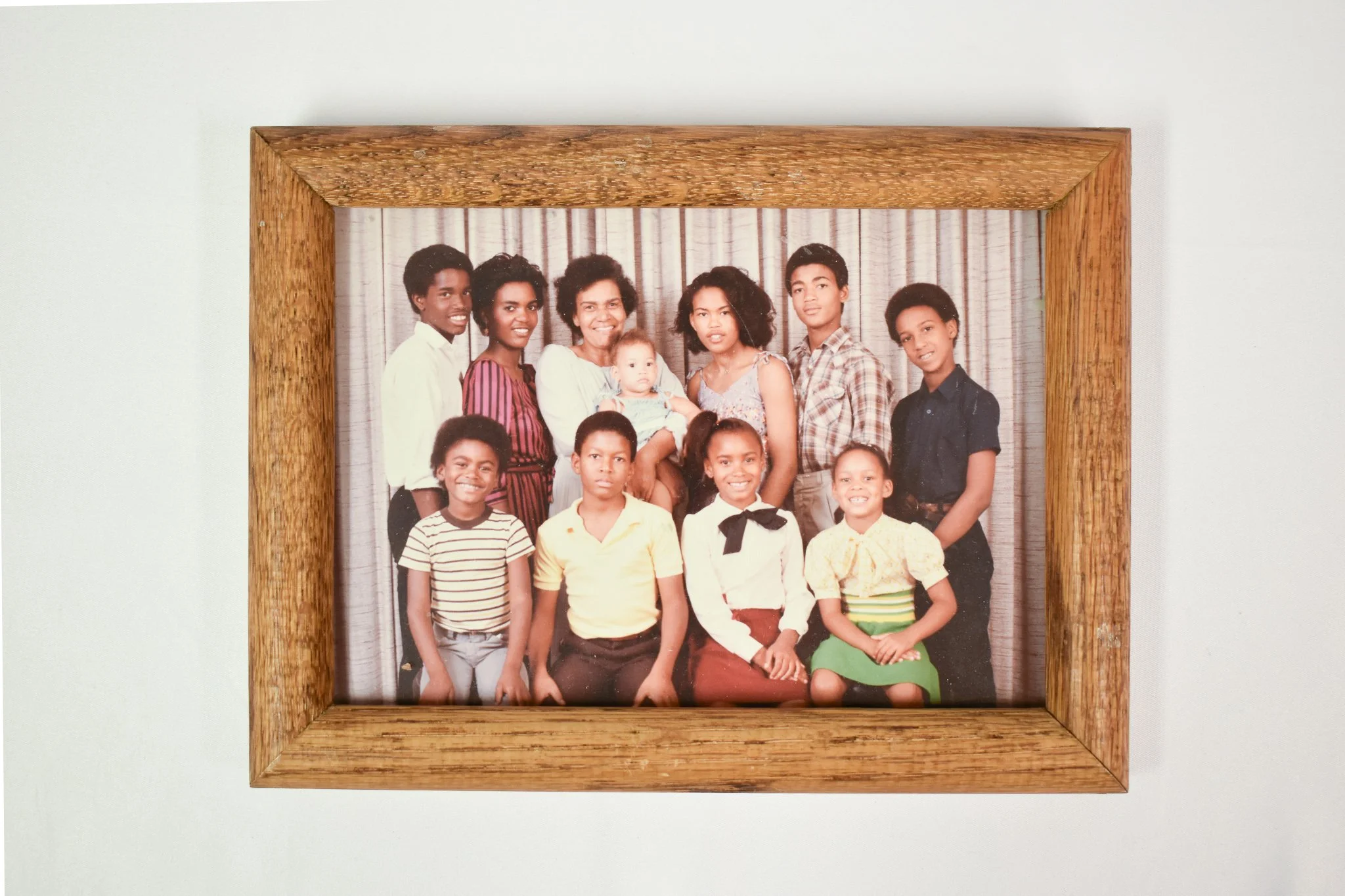 A family portrait from Candace’s childhood in Winnipeg with her mother and siblings; Candace is third from the right in the back row and her mother is holding Candace’s niece, Teryl.