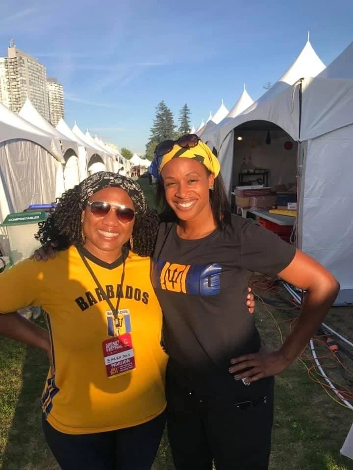 Phebe with friend Renita Drakes, who is also the President of the The Barbados Cultural Association of BC (BCABC). They were helping at the Barbados booth at Fusion Festival.