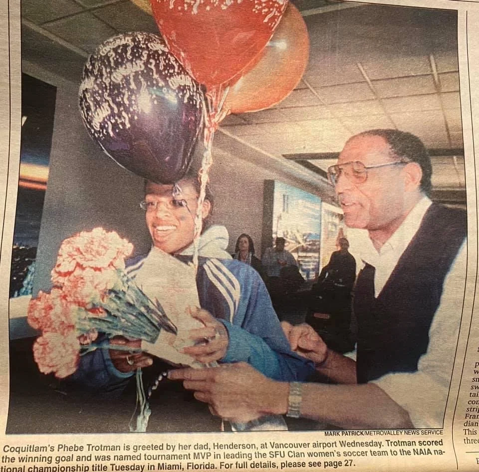 Phebe being greeted at YVR by her father Henderson after winning the NAIA National Championship in 2000. During the game in Miami, Florida, Phebe scored the winning goal in the 163rd minute during the fifth period of extra time.