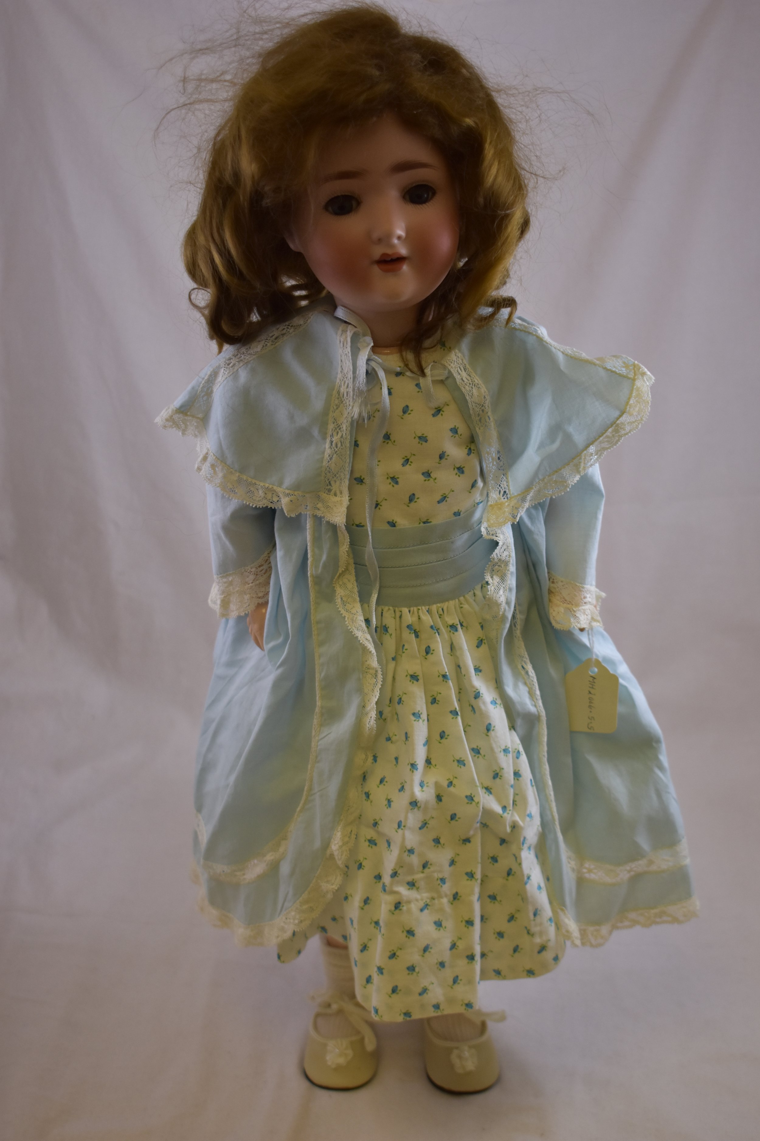 A beautiful Schoenau and Hoffmeister doll with bisque head, and a jointed composition body. 