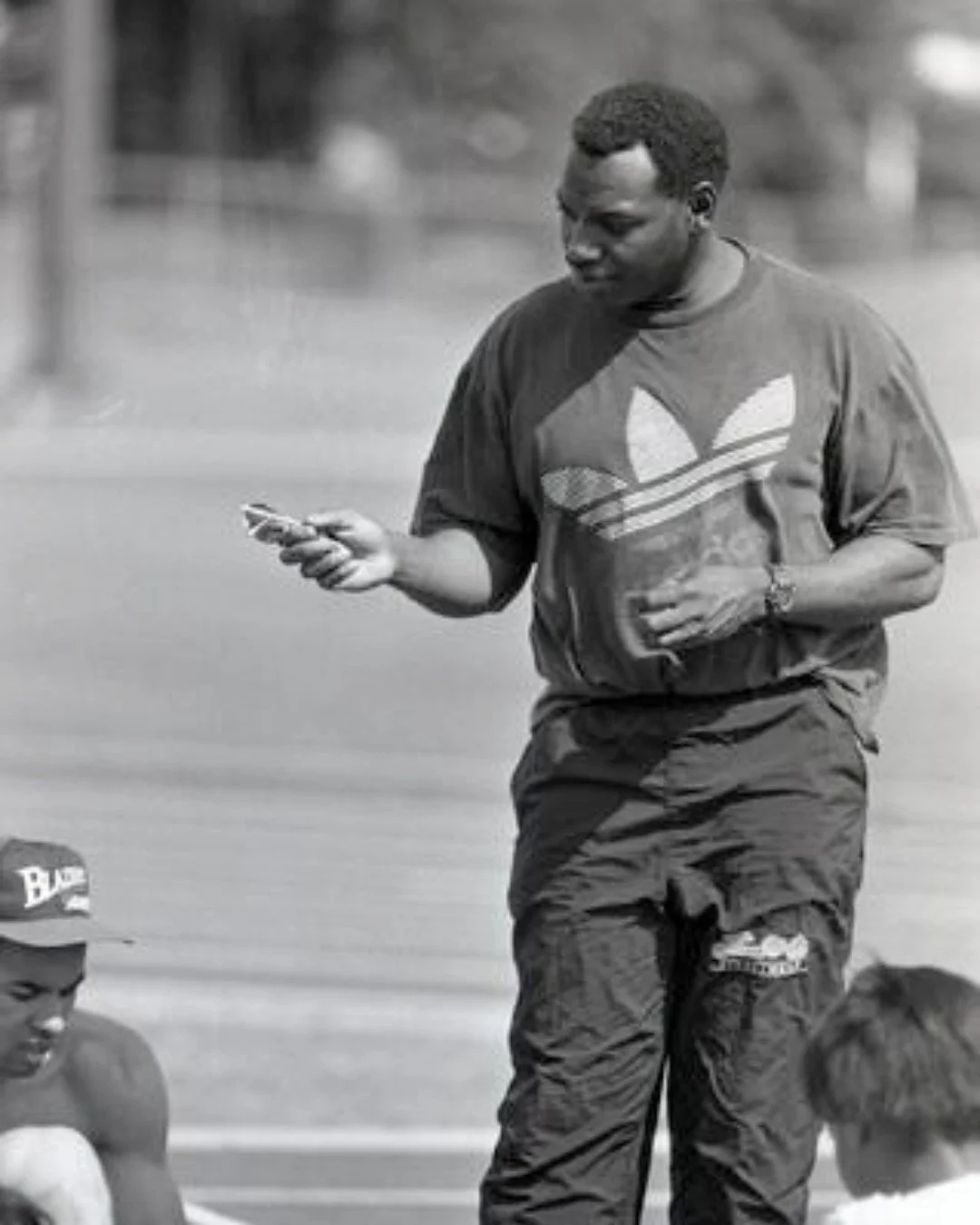 Now that the Olympics are on in Italy, you might find it fascinating to know that we had an Olympic sprinting coach from Coquitlam? 

This is a photo of track coach Mike Murray speaking to a group of athletes at Town Centre track. At age 12, Mike Mur