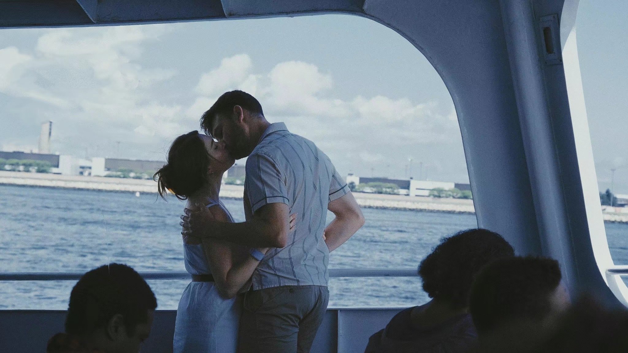 BOSTON, MA — A
couple shares a quiet
moment aboard a ferry
in the Seaport district in July
2023.