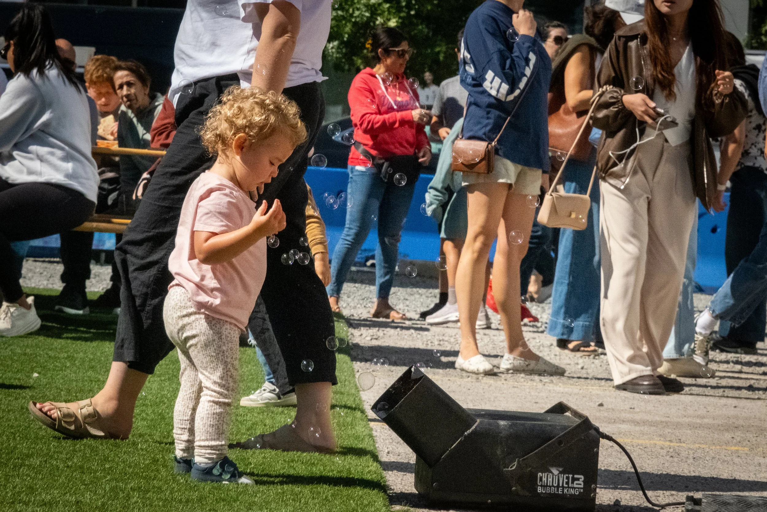 BOSTON,MA - A child watches bubbles
float through the air at a weekend market 
in the Seaport district on Sept. 23. For 
privacy, the girl chose not to share her 
name