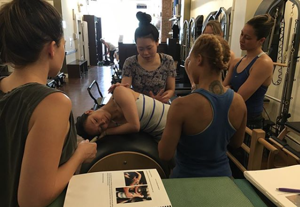 Group of women in a Pilates anatomy workshop