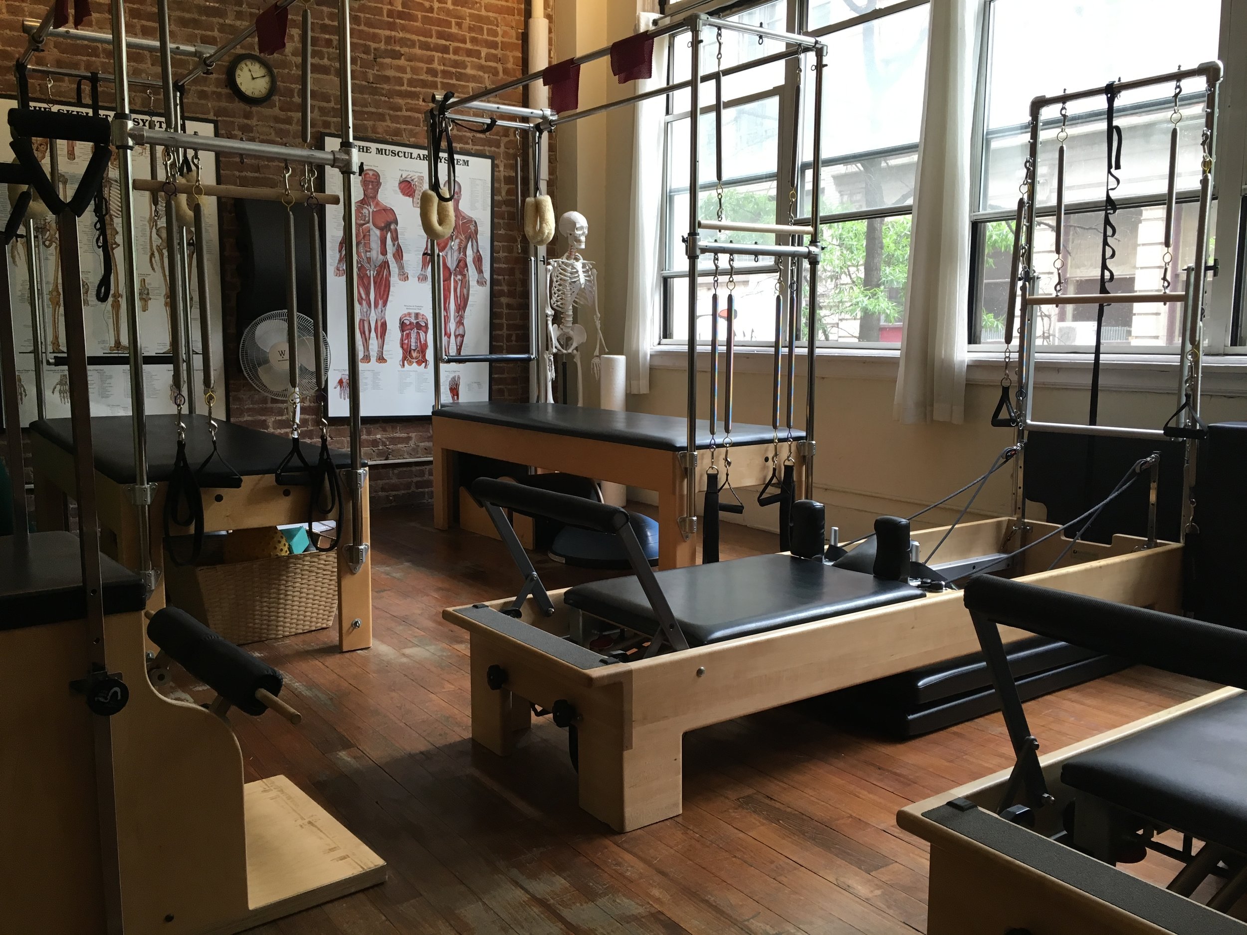 Pilates studio with reformers and equipment 