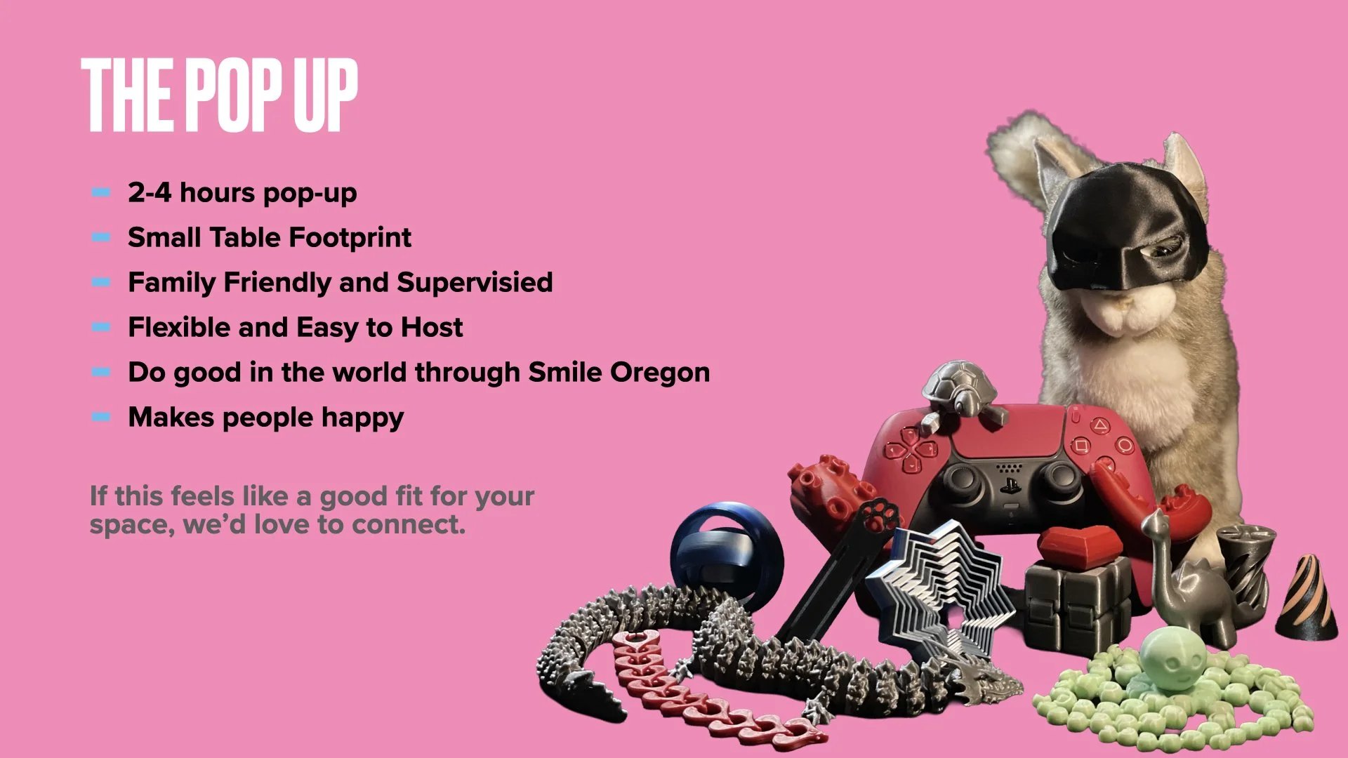 Text on pink background advertising a pop-up event with a list of features including duration, size, friendliness, flexibility, positive impact, and happiness. To the right, there is an assortment of toys and objects, including a cat wearing a mask, a red gaming controller, a toy dinosaur, beads, and other playful items.