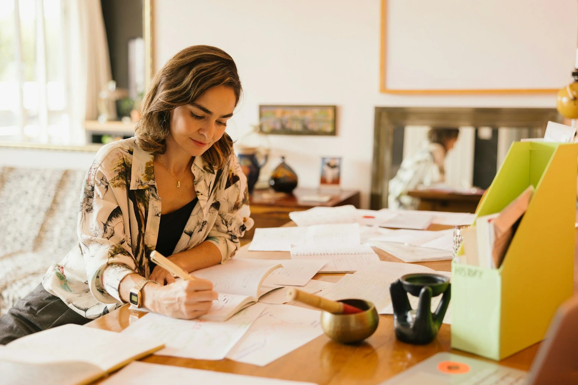 woman writing and working on marketing plan