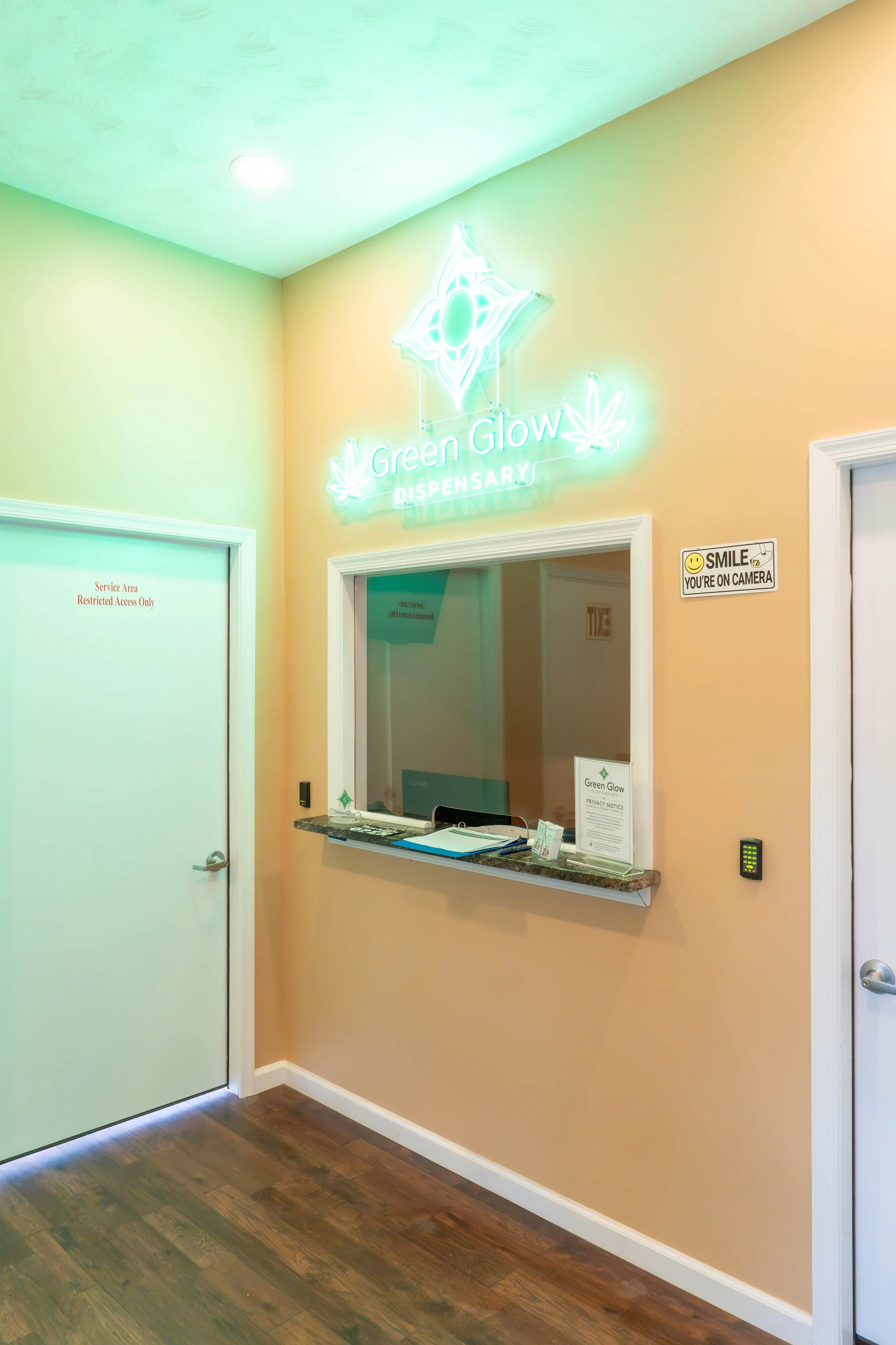 Green Glow Lobby Facing The Check In Counter and Green Glow Neon Lobby Green Neon Sign
