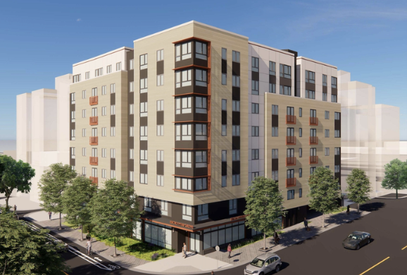 Multi-story residential building with retail space on the ground floor, surrounded by trees and parked cars, under a clear blue sky.