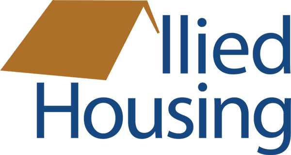 Logo of Built on Built Housing featuring a brown house roof and the words "Built Housing" in blue.