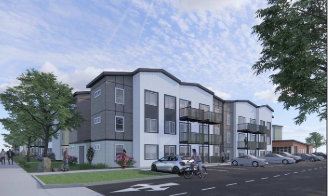 Modern apartment building with multiple levels, large glass windows, and balconies, situated in a suburban area with parked cars and trees.