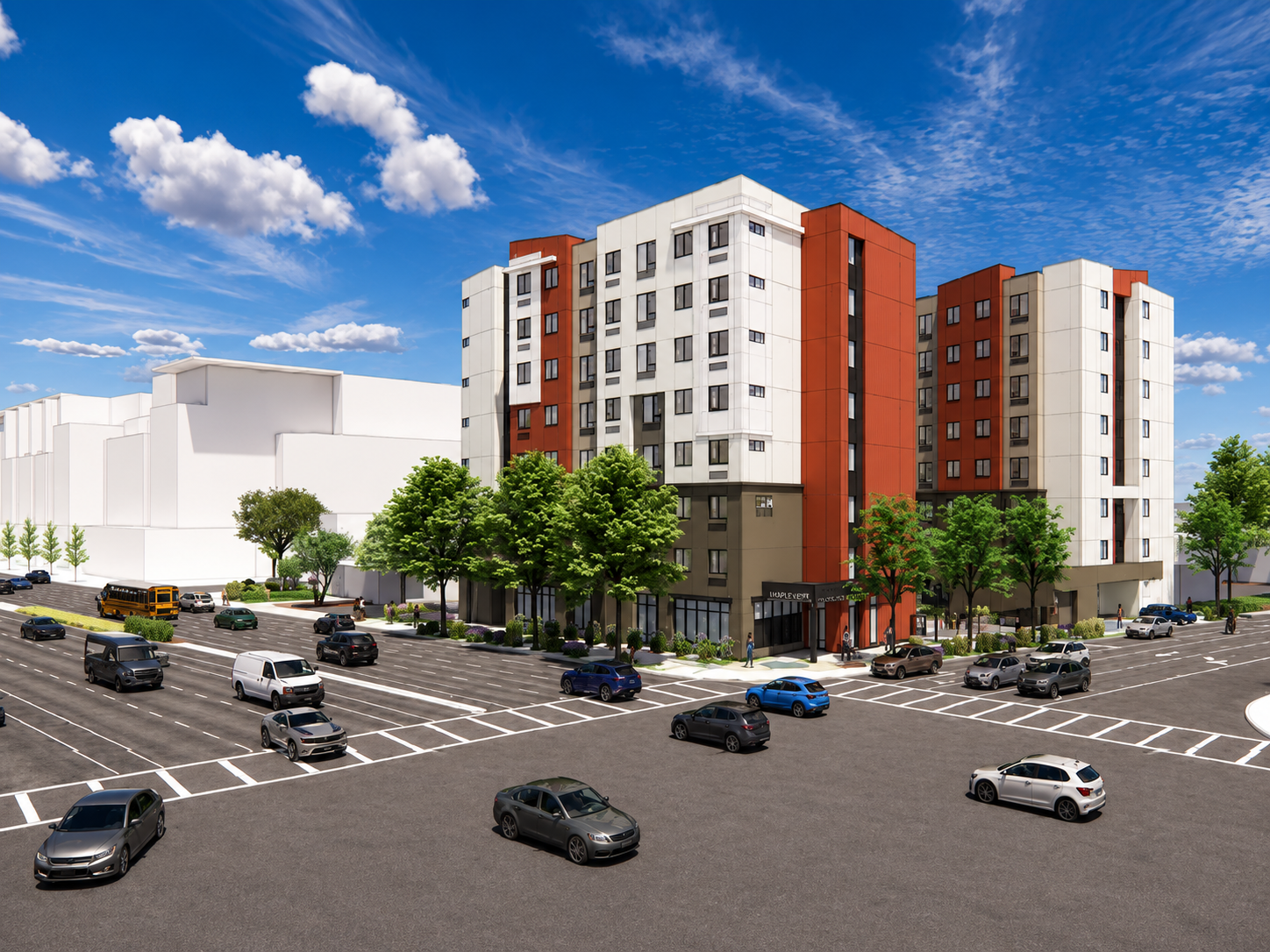 Colorful multi-story apartment building surrounded by trees, with a parking lot in the foreground filled with cars against a bright blue sky with scattered clouds.
