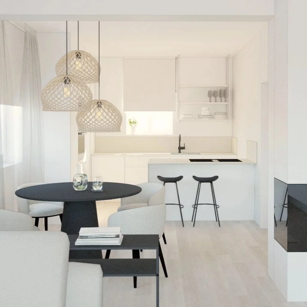 Modern minimalist kitchen and dining area with white cabinets, black accents, hanging pendant lights, and light wood flooring.