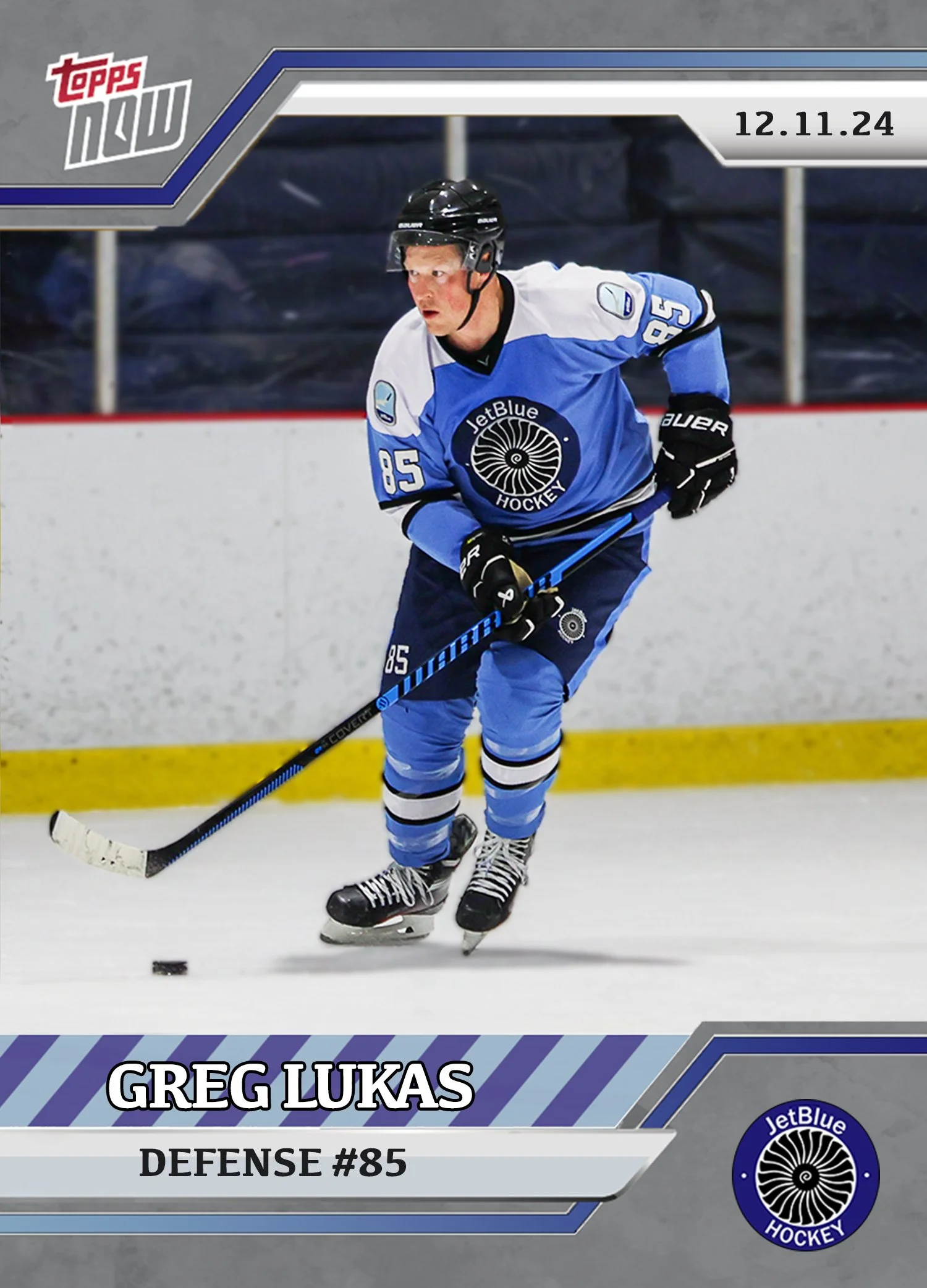 Hockey card featuring Greg Lukas in a blue and white JetBlue Hockey uniform, number 85, on ice with a puck nearby, date 12.11.24 at the top right corner.