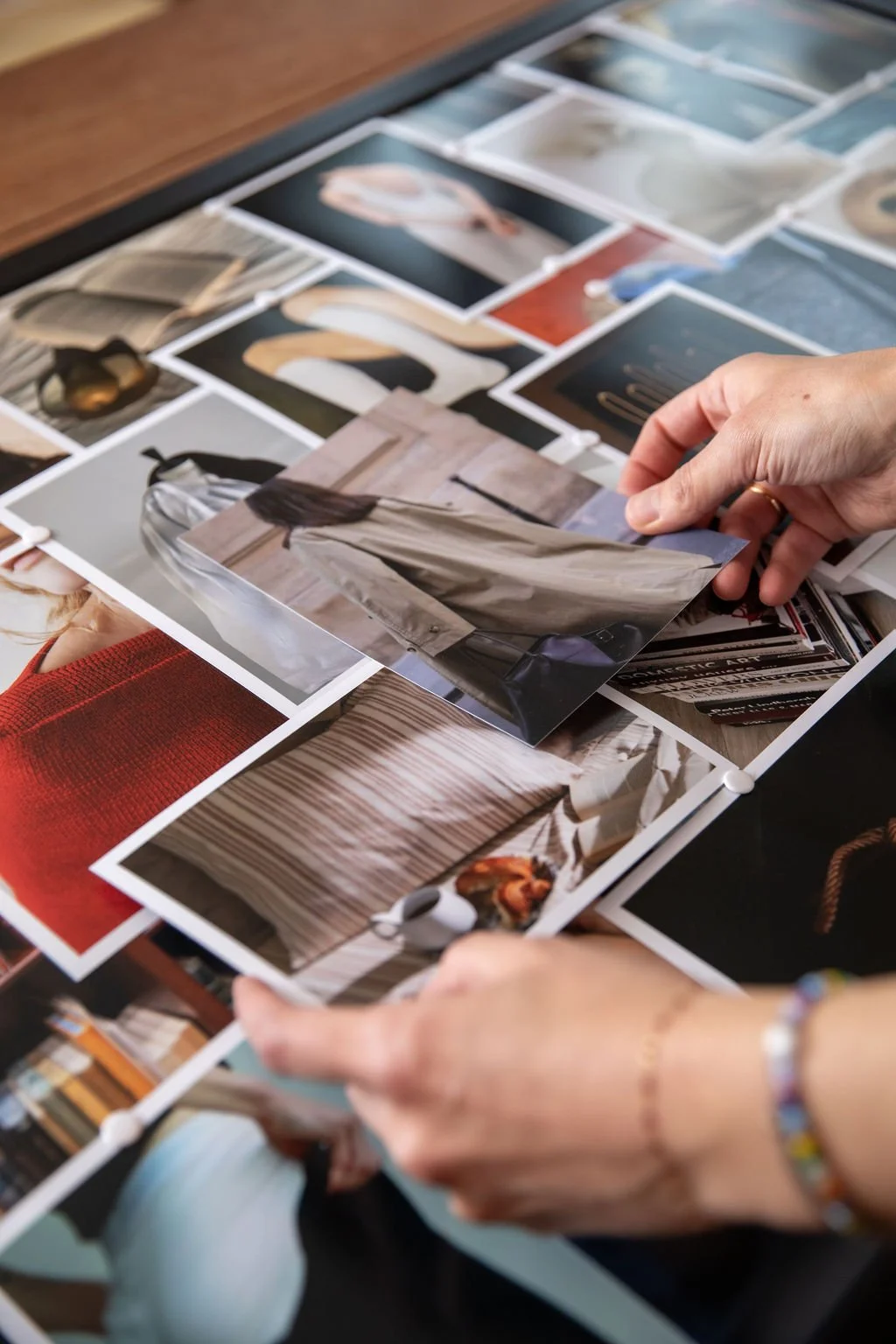 Christina Chernyak organizing inspiration photos for a client mood board.