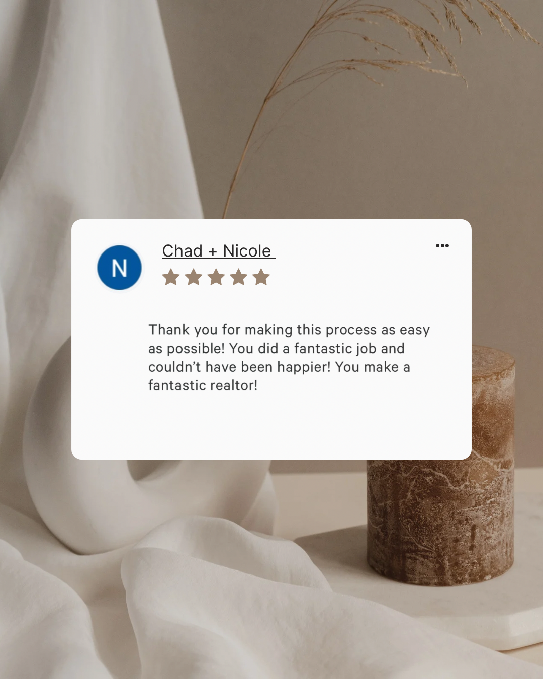 A customer review overlay on a neutral-toned still life photograph with a white ceramic vase, a textured cylindrical object, and some decorative dried grass.