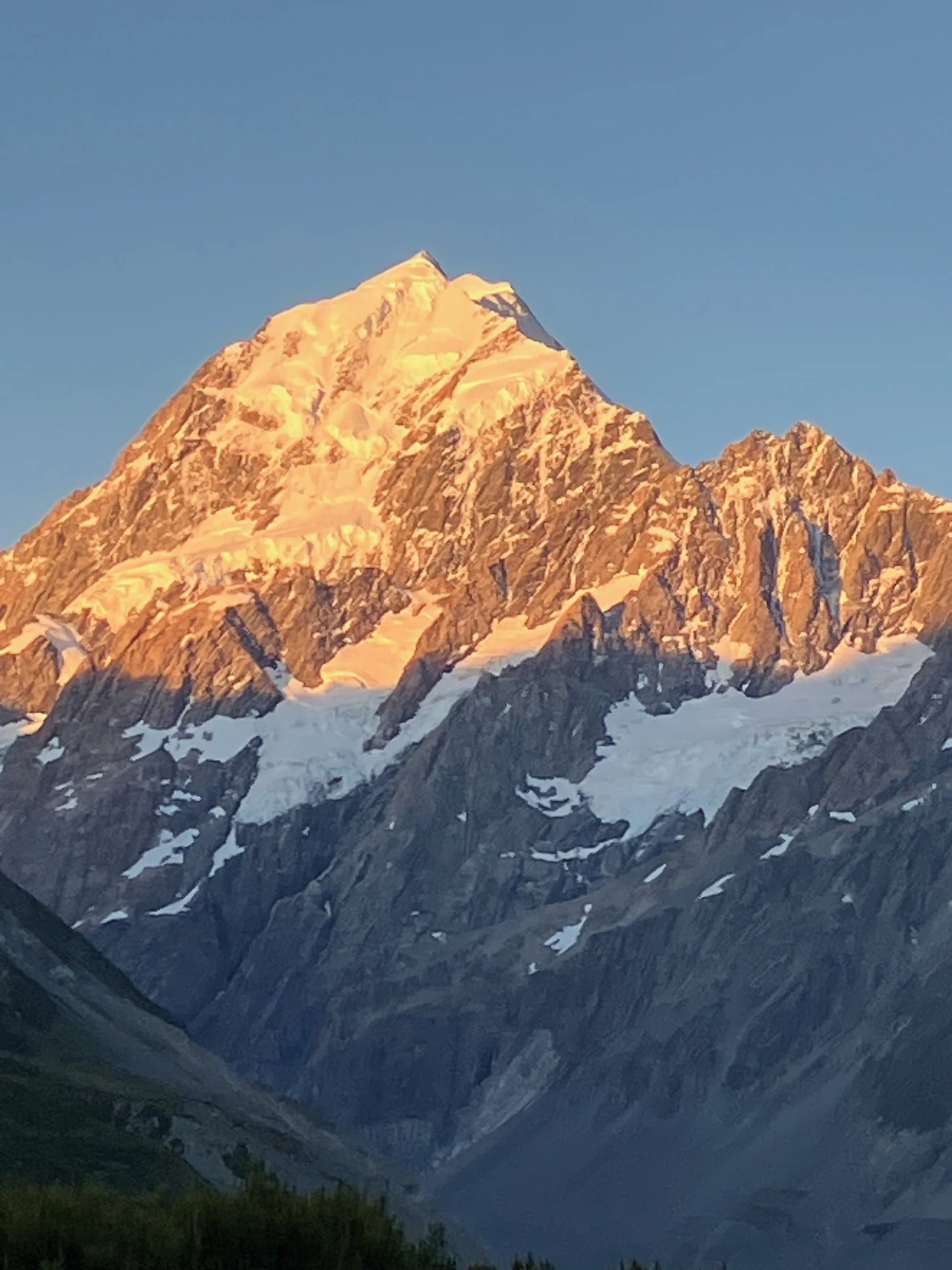 Mount Aoraki, New Zealand's highest peak during sunset with clear blue January, sky.