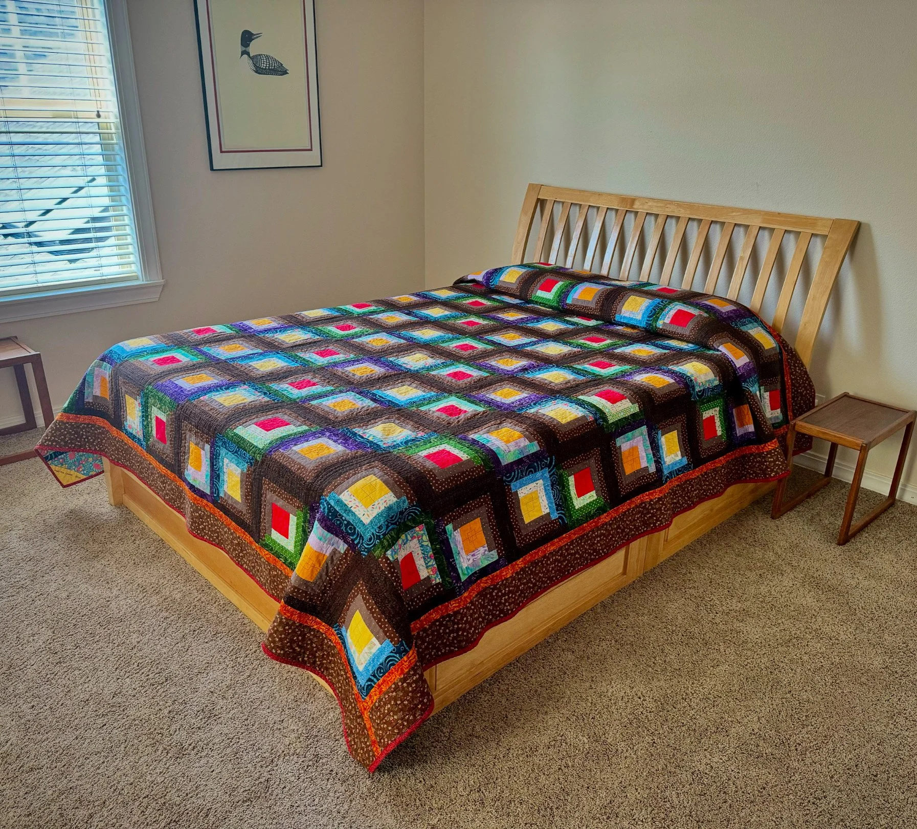 Patrice Dodd — "Wonky Log Cabin" Quilt, 109" x 92" ($300 value)
A queen-size quilt, long enough to tuck under your pillows, built from a Wonky Log Cabin block designed by Monica Poole of Pattern Poole. Patrice Dodd pieced, quilted, and bound it herse