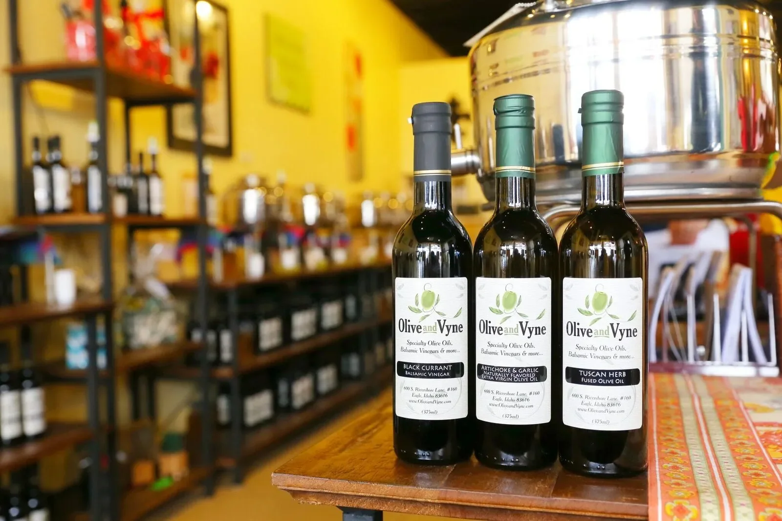 Olive & Vyne — Gift Item ($75 value)
A tasting room in Eagle stocked with more than 45 kinds of olive oil and balsamic vinegar, the kind of shop where the owner talks you through every bottle before you buy one. A gift toward turning a plain weeknigh