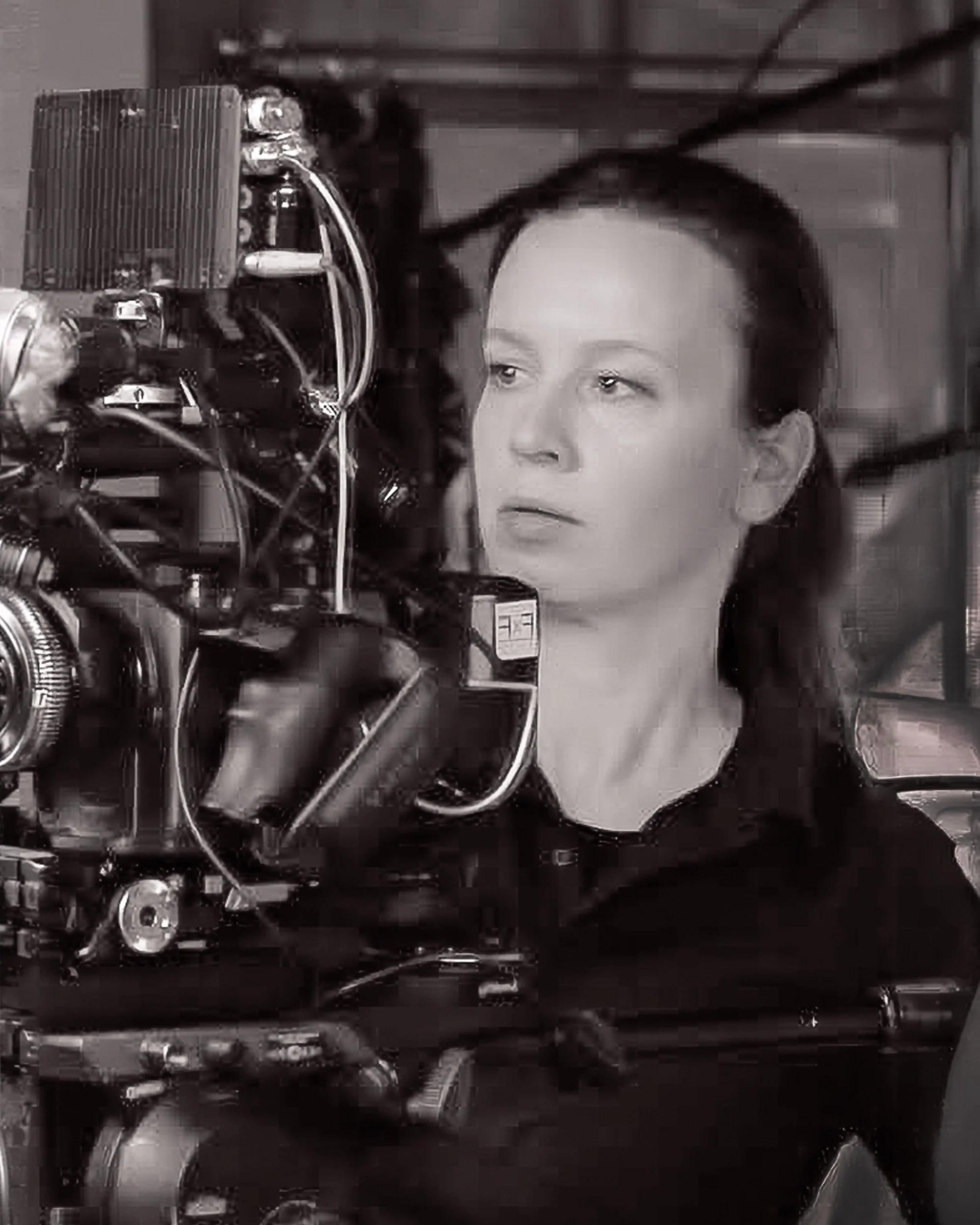 April Frame female filming with large movie camera