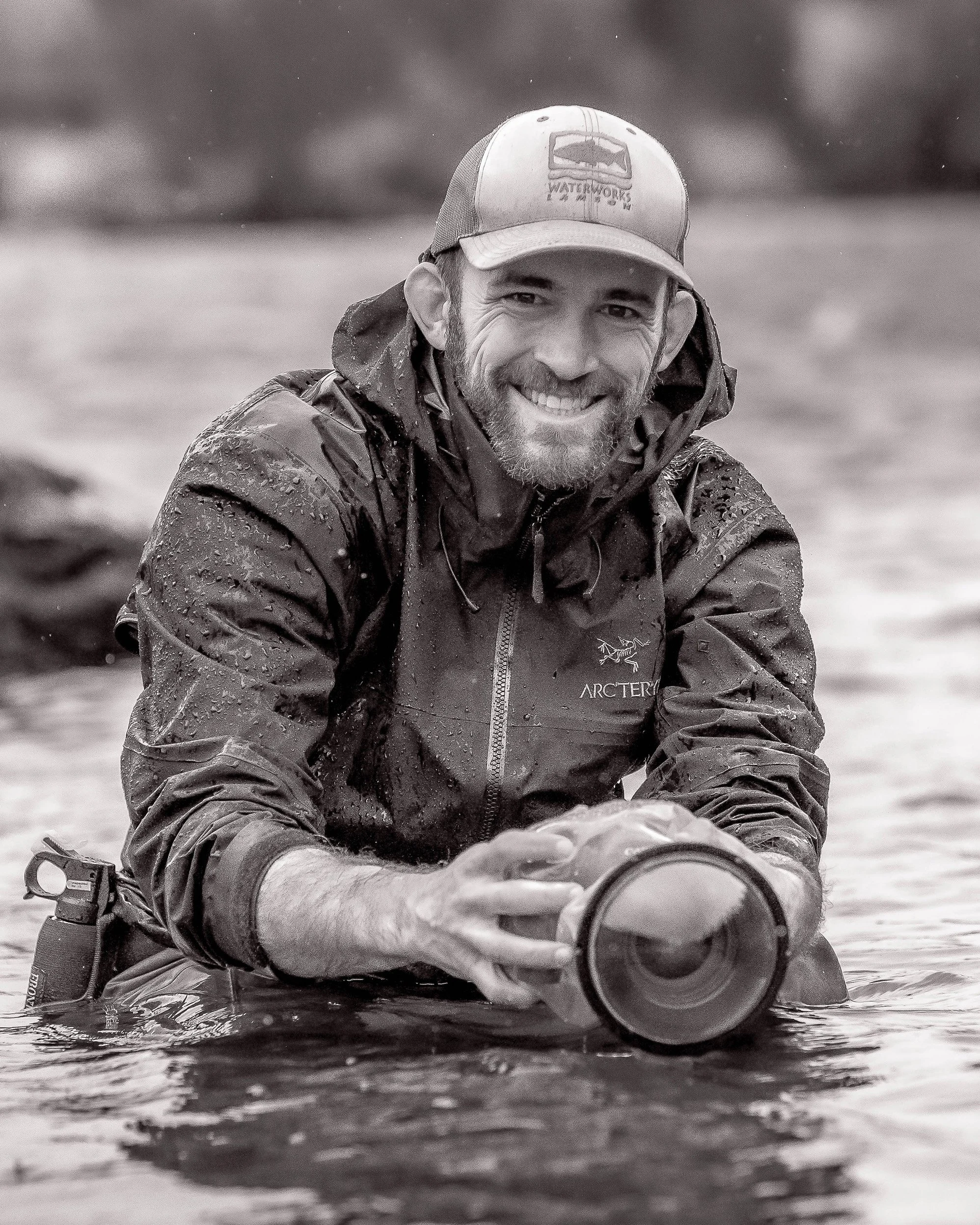 Will Bales man filming in river in the rain