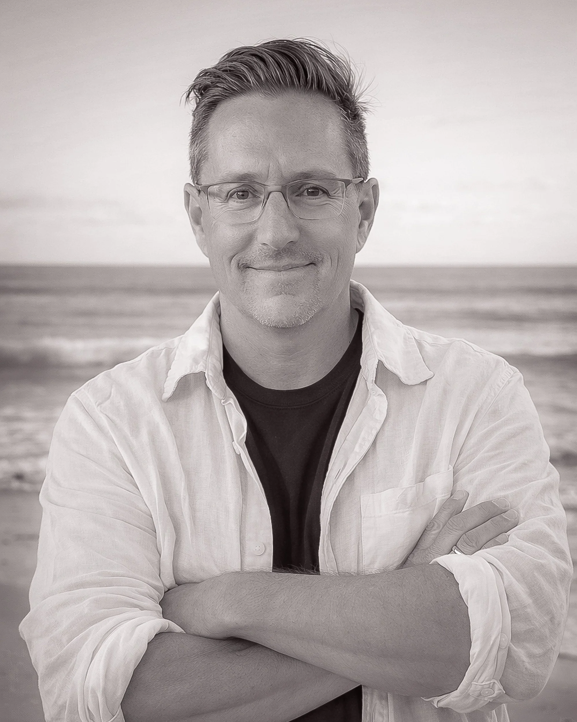 Matt Graif in shirt sleeves on beach