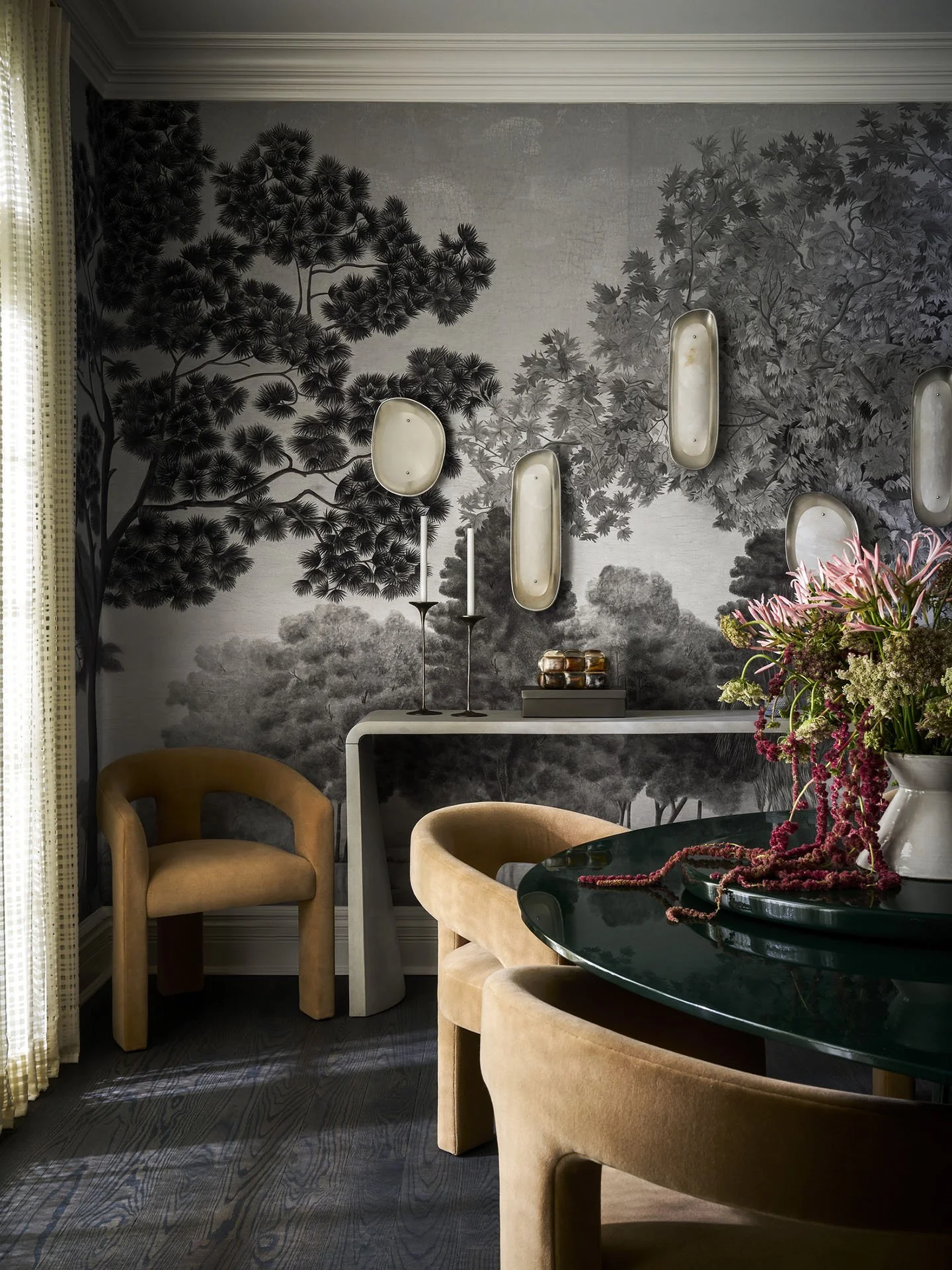 Elegant dining room with scenic mural wallpaper and modern wall sconces in Kenilworth residence.