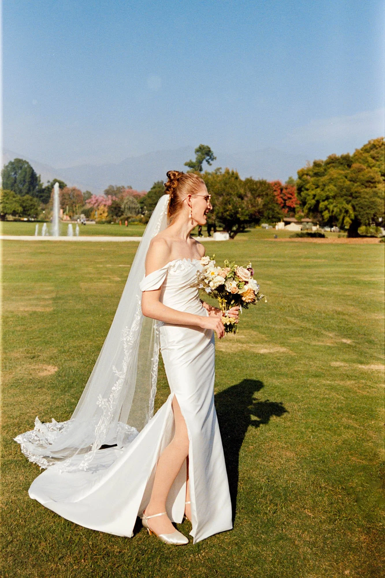 Bride on wedding day at The Huntington Library Los Angeles sunny day on 35mm film