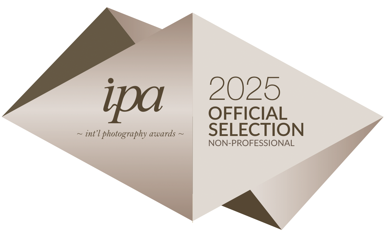 Award banner for the 2025 IPA International Photography Awards, Non-Professional category, with a geometric design in shades of beige, brown, and yellow.