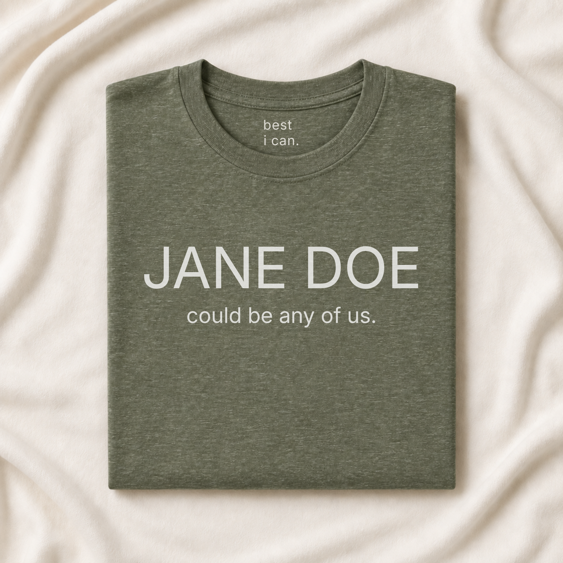 jane doe could be any of us. t-shirt in heather military green, folded