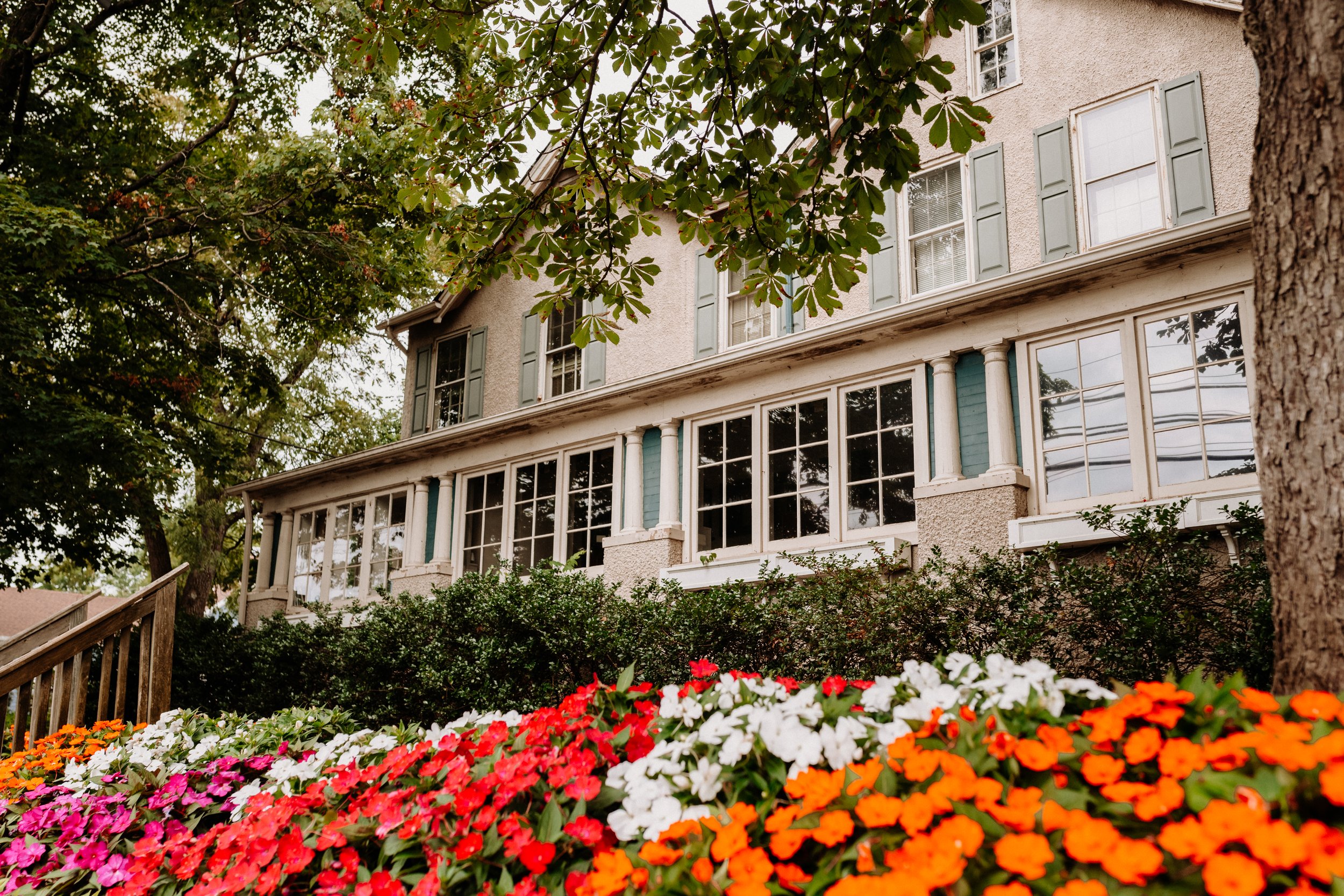 the current simms building exterior with hedges and flowers