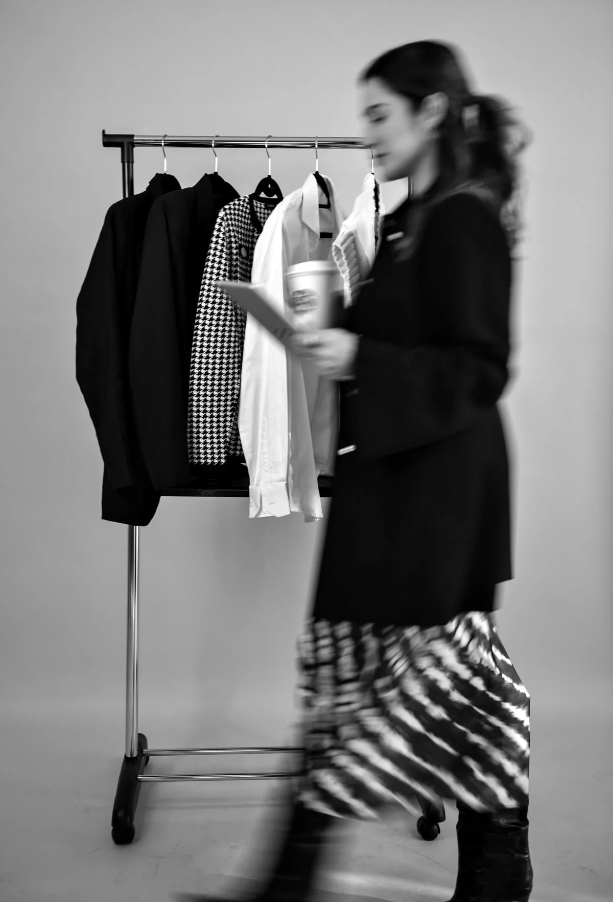 A woman working in a closet in new jersey doing personal styling and wardrobe refresh