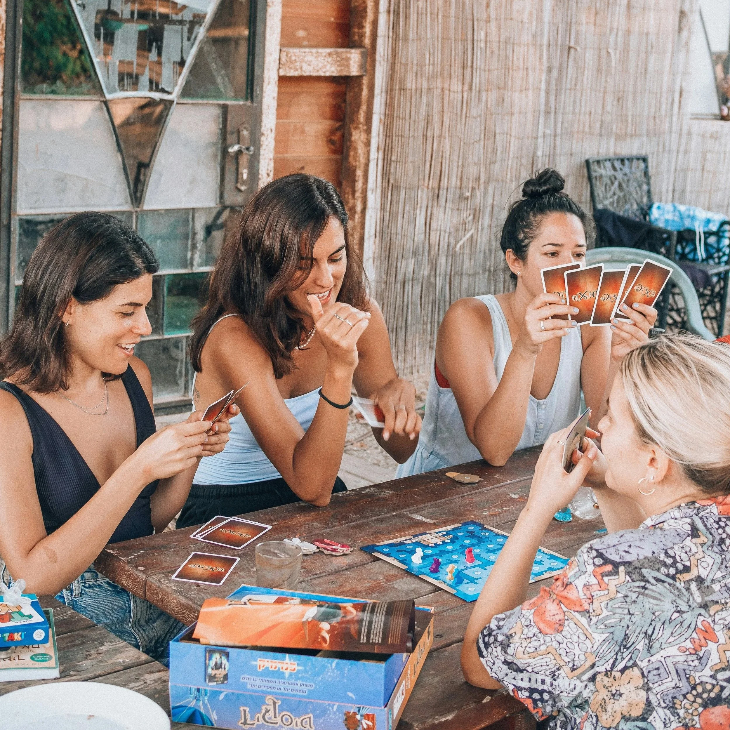 Women playing a card game together