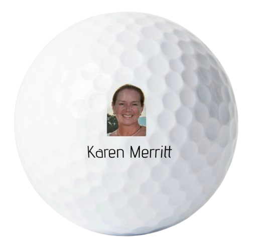 A golf ball with a photo of a woman and the name Karen Merritt printed on it.