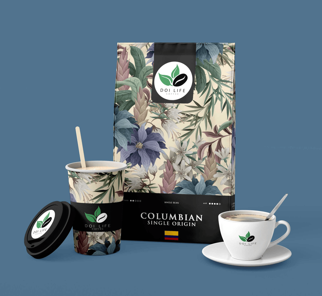A package of Doi Life Columbian single-origin coffee beans, a coffee cup and saucer, and a paper coffee cup with a lid and a stirring stick, all featuring the Doi Life logo and floral design.
