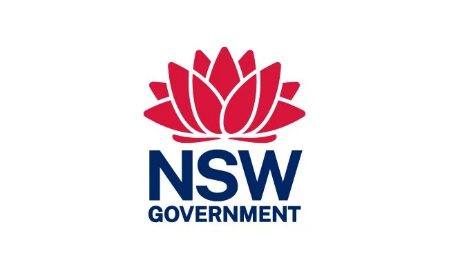New South Wales government logo with a pink flower above the text.